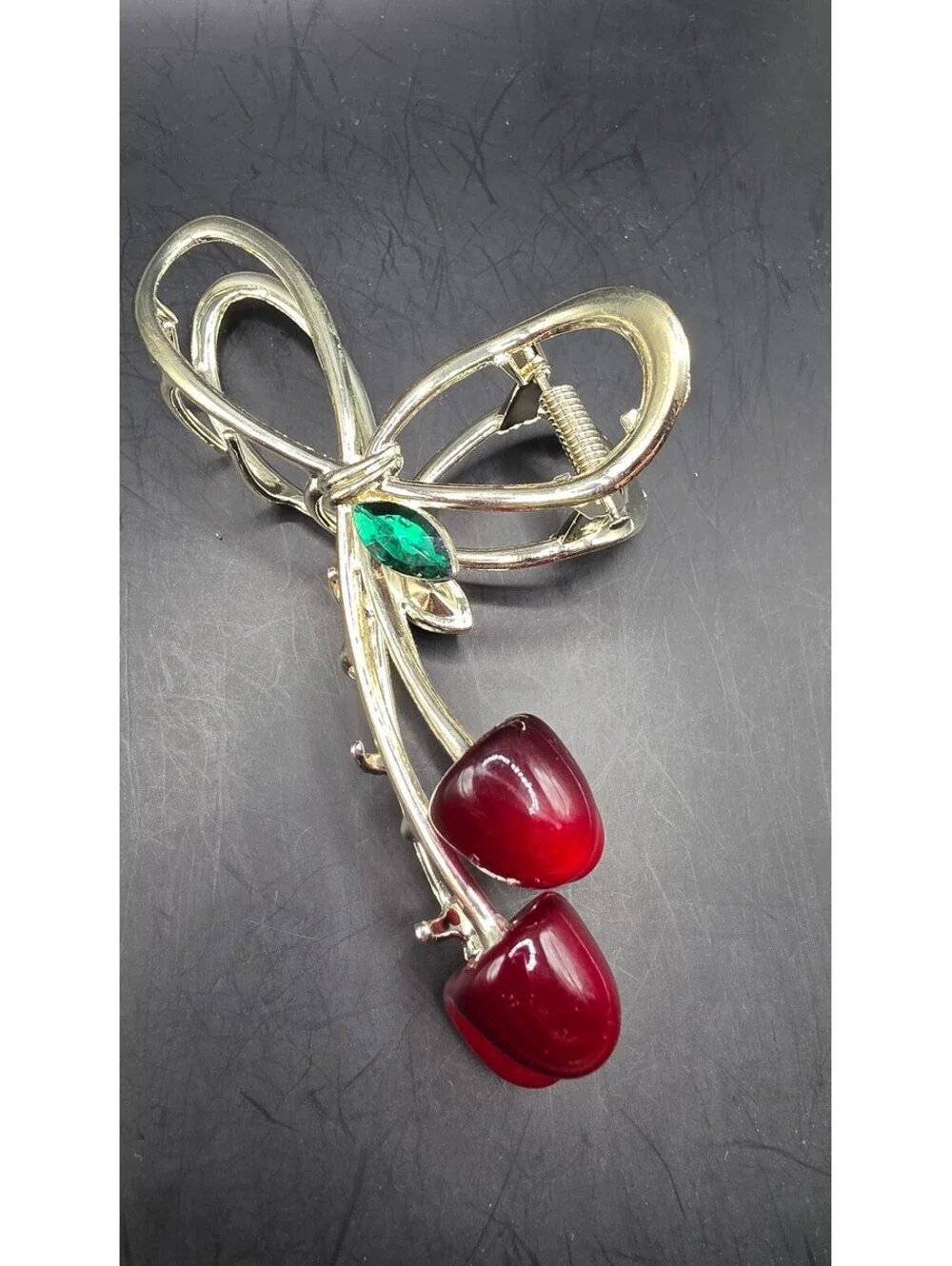Elegant Gold-Tone Cherry Bow Hair Clip with Red Accents and Green Leaf Detail –